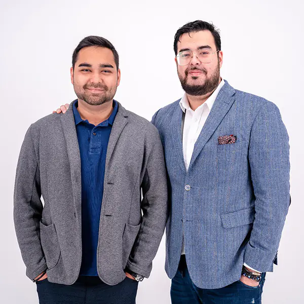 Two ecommerce startup founders dressed in casual business attire side by side