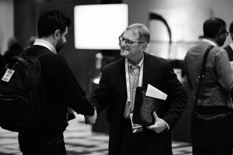 investor and founder shaking hands at CIX Summit