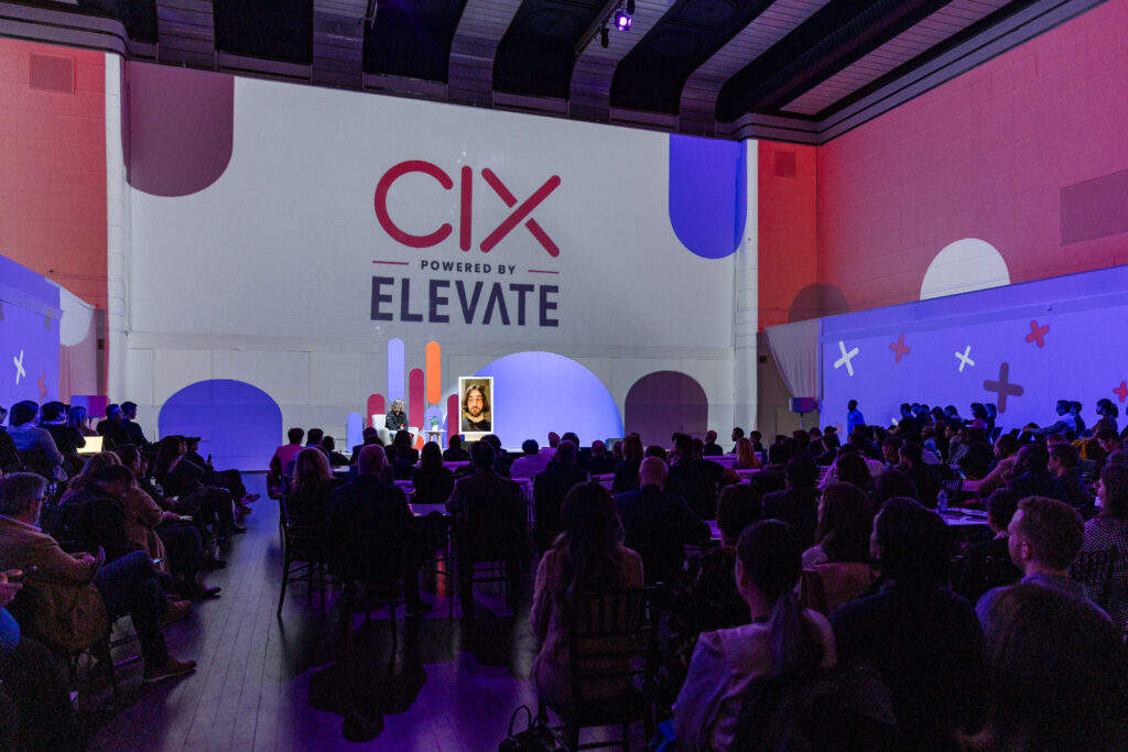 The audience at the CIX Summit watching a fireside chat with our Innovator of the Year, Cohere